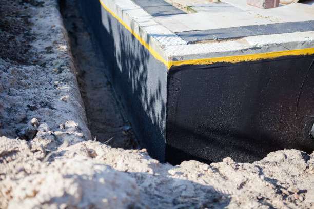 Professional Emergency Waterproofing technician working in Catonsville, MD